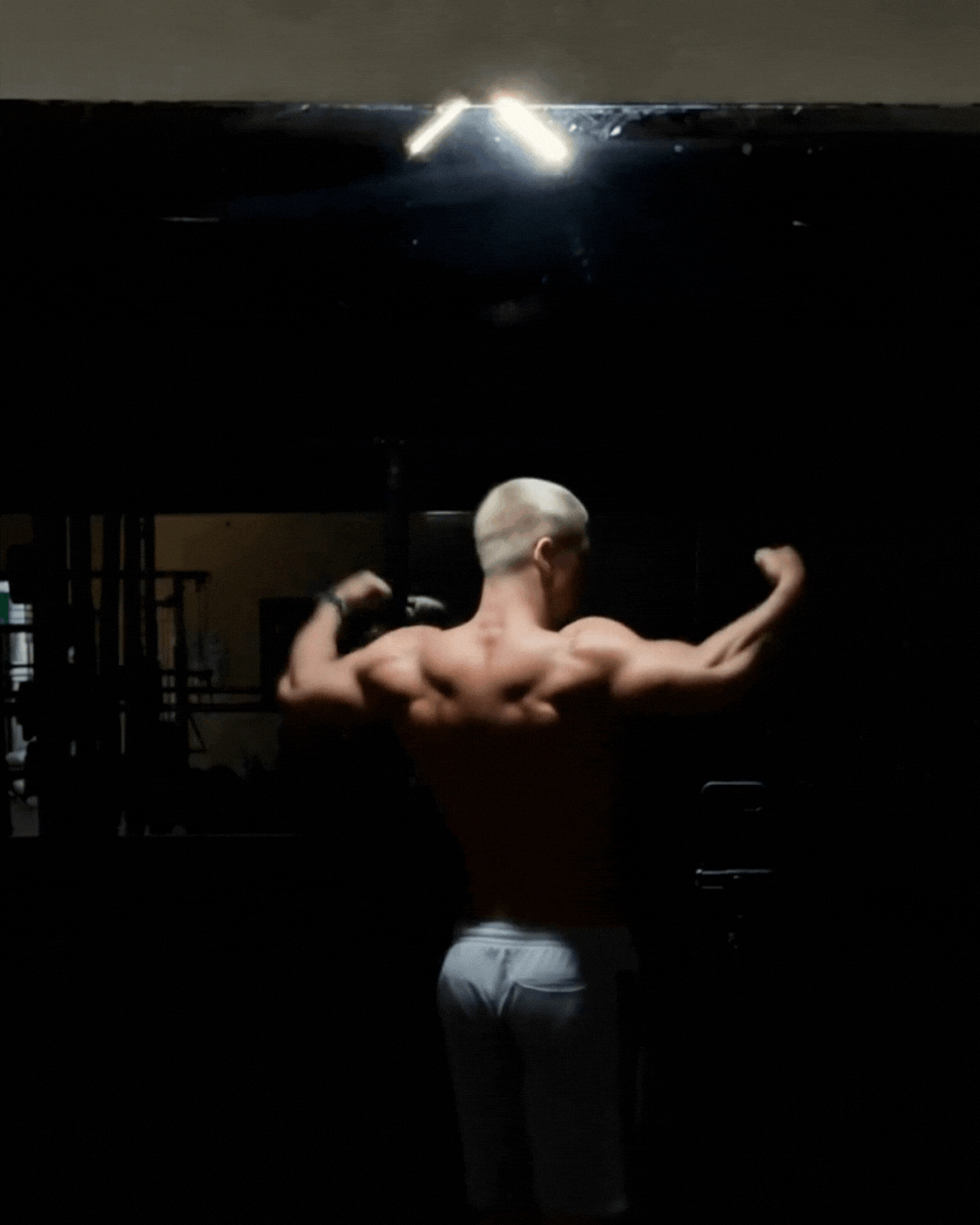 Magnetic base lamp mounted on gym equipment for hands-free workout photos